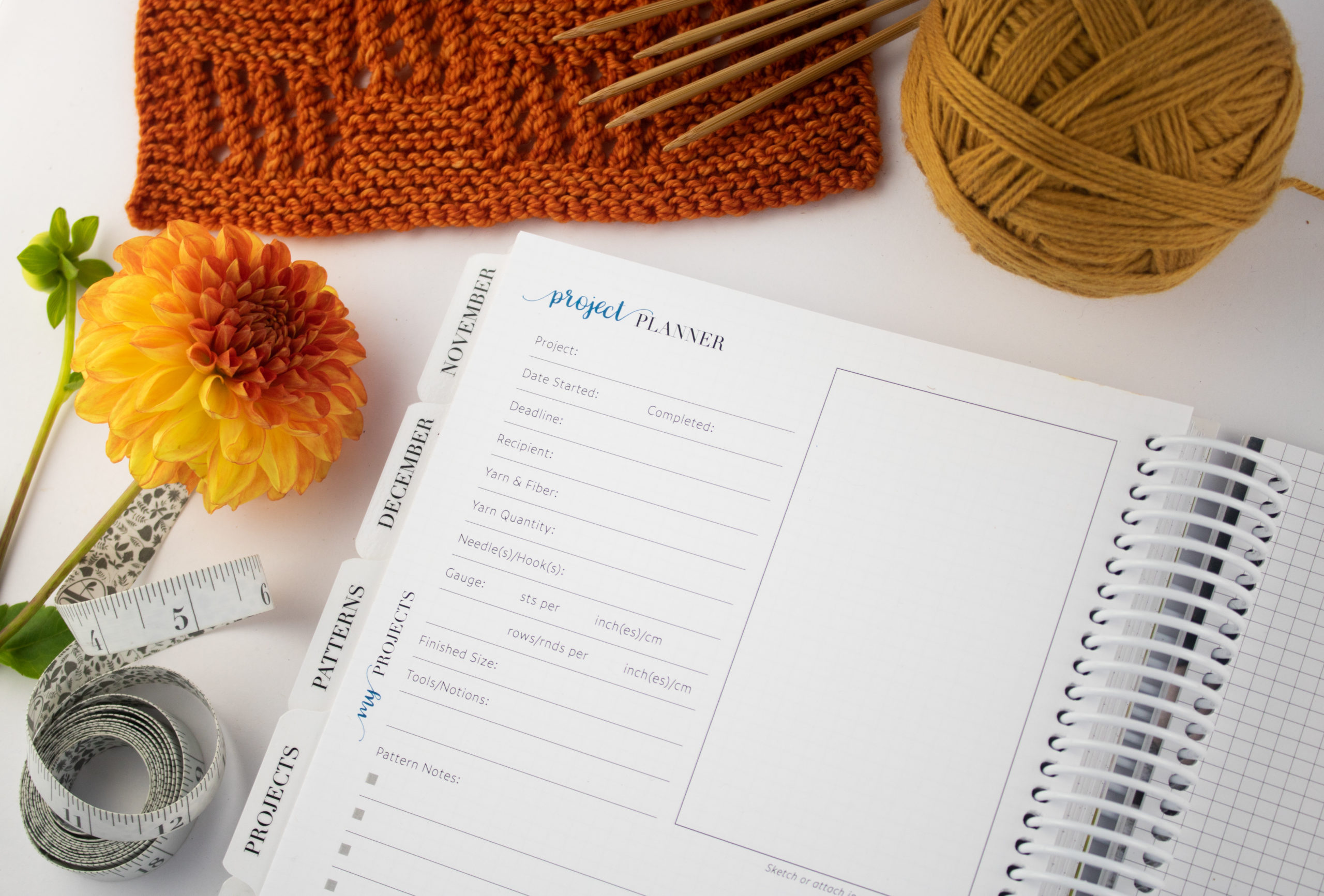 The Knitter's Planner Project planner page with orange swatch and yellow yarn